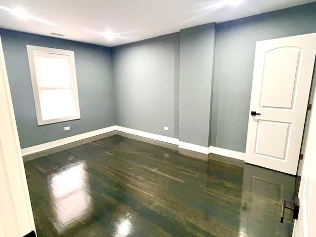 7042 S Eberhart Ave, Chicago, IL 60637 - unfurnished room with wood finished floors and baseboards