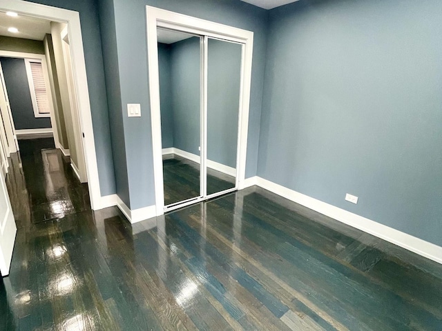 7042 S Eberhart Ave, Chicago, IL 60637 - empty room with wood finished floors and baseboards