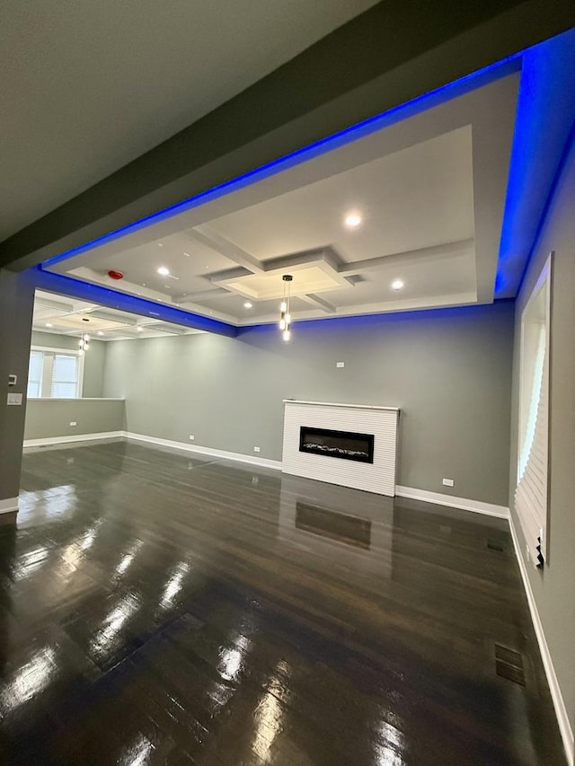 7042 S Eberhart Ave, Chicago, IL 60637 - unfurnished living room featuring coffered ceiling, wood finished floors, a glass covered fireplace, beamed ceiling, and recessed lighting