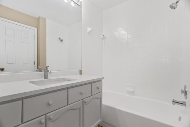bathroom featuring bathtub / shower combination and vanity