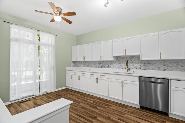 kitchen featuring dishwasher, a sink, ceiling fan, and white cabinetry