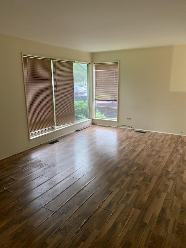 2107 Flicker Ln, Rolling Meadows, IL 60008 - spare room with dark wood-type flooring
