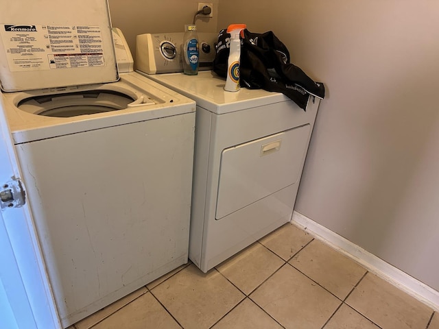 4107 W 16th St, Chicago, IL 60623 - laundry room with washer and clothes dryer and light tile patterned floors