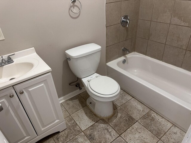 4107 W 16th St, Chicago, IL 60623 - bathroom with baseboards, vanity, toilet, and shower / bathtub combination