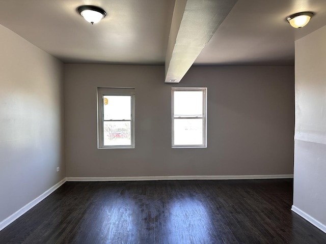 4107 W 16th St, Chicago, IL 60623 - spare room with dark wood-type flooring and baseboards