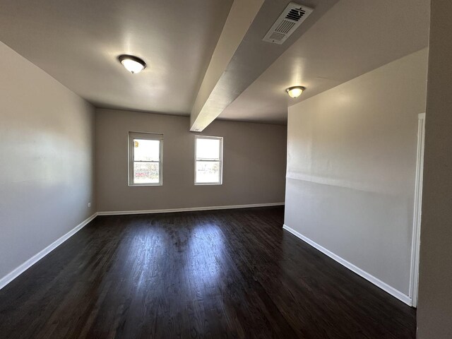 4107 W 16th St, Chicago, IL 60623 - empty room featuring dark wood-type flooring and baseboards