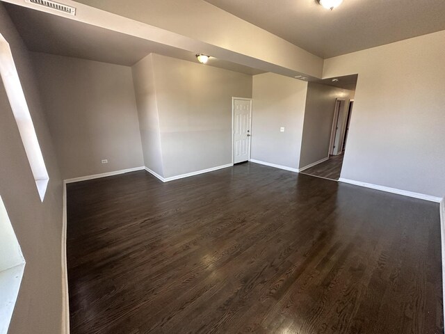4107 W 16th St, Chicago, IL 60623 - unfurnished room with dark wood-type flooring and baseboards