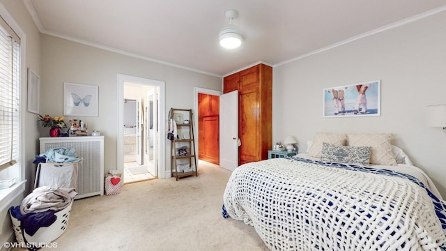 2335 N Commonwealth Ave Unit 2G, Chicago, IL 60614 - bedroom with ensuite bath, ornamental molding, and light colored carpet
