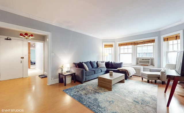2335 N Commonwealth Ave Unit 2G, Chicago, IL 60614 - living room with light wood-style floors, cooling unit, and ornamental molding