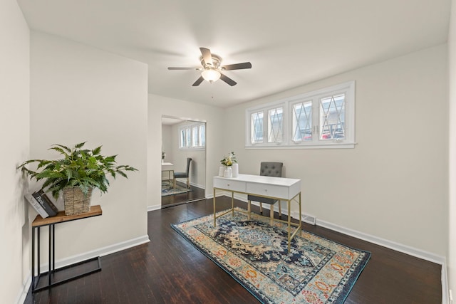 office with baseboards, ceiling fan, wood finished floors, and visible vents
