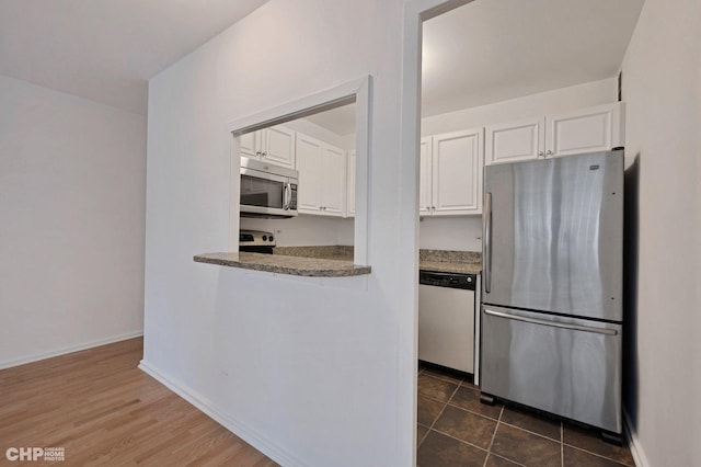 33 E Cedar St Unit 3H, Chicago, IL 60611 - kitchen with appliances with stainless steel finishes and white cabinetry
