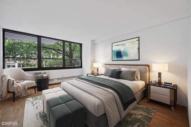 33 E Cedar St Unit 3H, Chicago, IL 60611 - bedroom with a baseboard radiator and wood finished floors