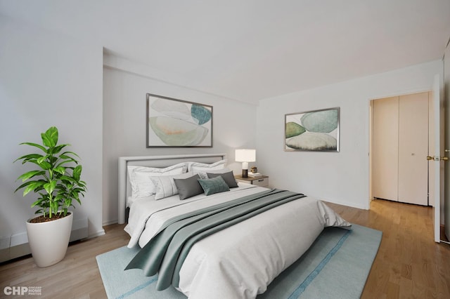 33 E Cedar St Unit 3H, Chicago, IL 60611 - bedroom with wood finished floors