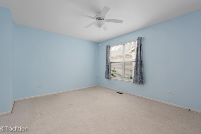 unfurnished room featuring visible vents, baseboards, ceiling fan, and carpet floors