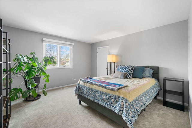 carpeted bedroom with baseboards