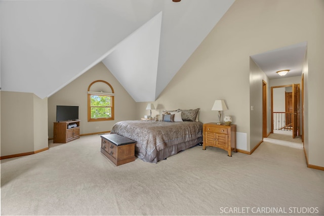 bedroom featuring baseboards, carpet flooring, and lofted ceiling