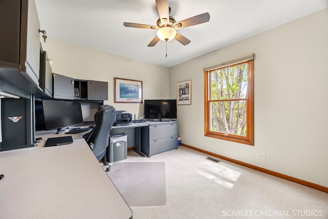 home office featuring ceiling fan, visible vents, light carpet, and baseboards