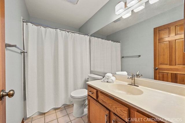 bathroom featuring a shower with curtain, tile patterned floors, vanity, and toilet
