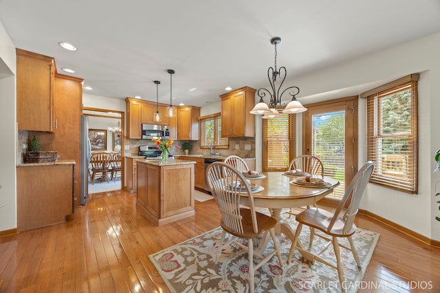 dining area with recessed lighting, baseboards, and light wood-style flooring