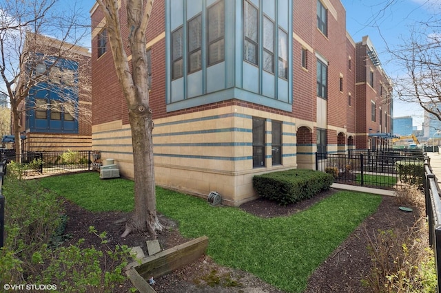 view of building exterior featuring fence