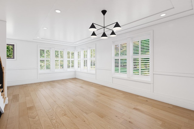 unfurnished sunroom with a chandelier and plenty of natural light