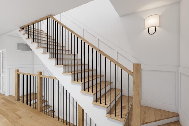stairs with wood finished floors