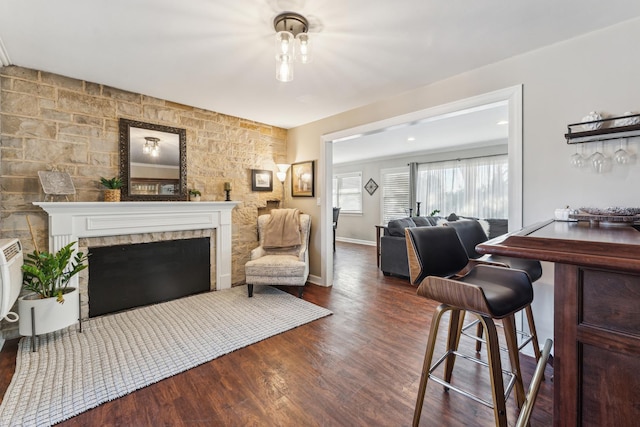 353 E Butterfield Rd, Elmhurst, IL 60126 - living room featuring wood finished floors, a fireplace, and baseboards