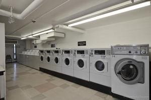 shared laundry area with washer and clothes dryer and light floors