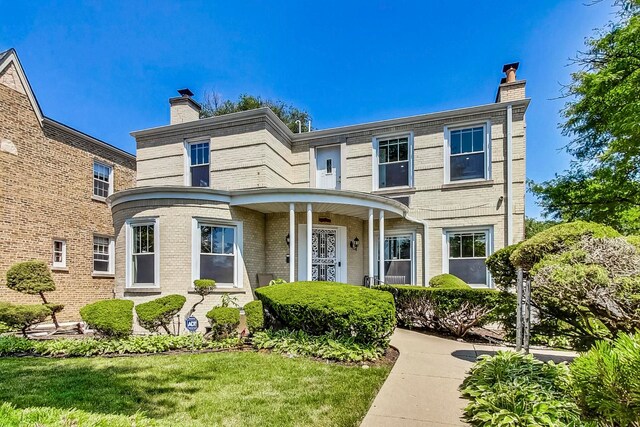 5801 N Drake Ave, Chicago, IL 60659 - view of front of property with brick siding and a chimney