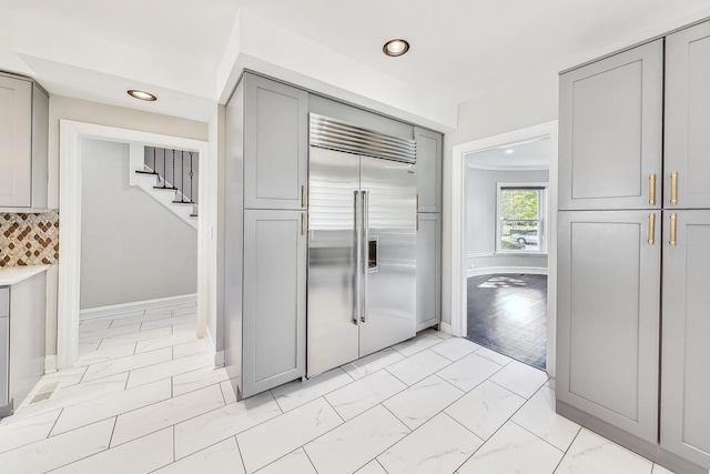 5801 N Drake Ave, Chicago, IL 60659 - kitchen featuring recessed lighting, marble finish floor, gray cabinetry, baseboards, and stainless steel built in fridge