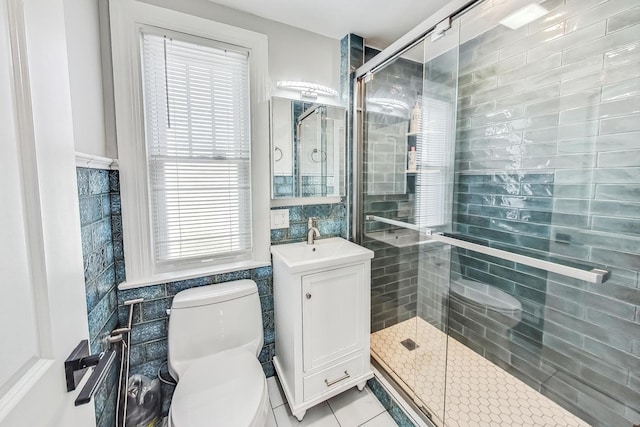 5801 N Drake Ave, Chicago, IL 60659 - full bathroom featuring a shower stall, tile patterned floors, tile walls, and toilet