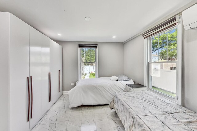 5801 N Drake Ave, Chicago, IL 60659 - bedroom featuring recessed lighting, marble finish floor, and a wall mounted air conditioner