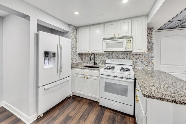 5801 N Drake Ave, Chicago, IL 60659 - kitchen featuring light stone counters, white appliances, white cabinetry, dark wood finished floors, and a sink