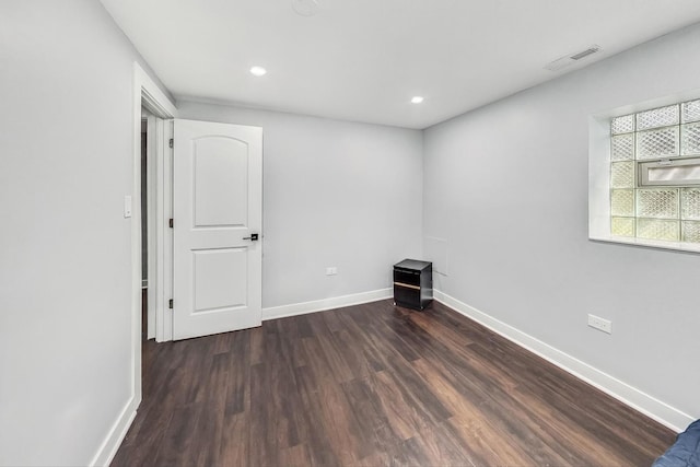 5801 N Drake Ave, Chicago, IL 60659 - empty room with visible vents, baseboards, and wood finished floors