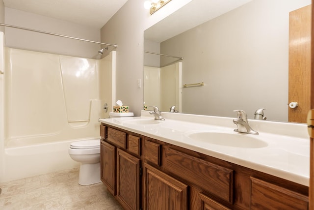 bathroom featuring tub / shower combination, toilet, a sink, and double vanity