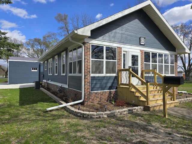 601 Powell St, Streator, IL 61364 - exterior space with a lawn and central air condition unit