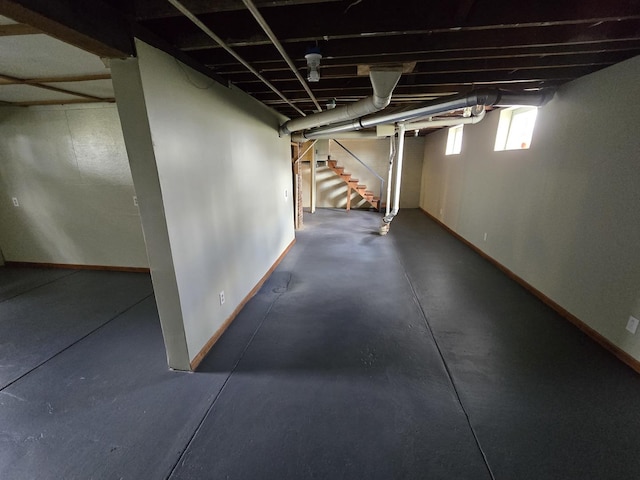 601 Powell St, Streator, IL 61364 - basement featuring baseboards and stairway