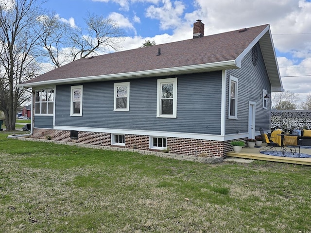 601 Powell St, Streator, IL 61364 - rear view of property with a yard, roof with shingles, and a chimney