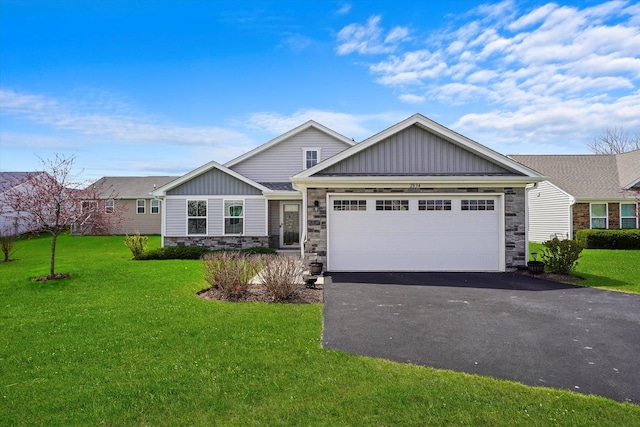 2834 Ketchum Ct, Yorkville, IL 60560 - ranch-style house featuring a front yard, driveway, stone siding, and board and batten siding