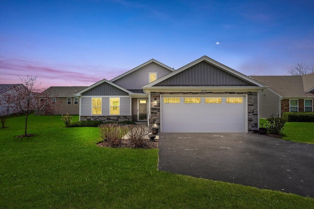 2834 Ketchum Ct, Yorkville, IL 60560 - ranch-style home featuring a front yard, an attached garage, stone siding, aphalt driveway, and board and batten siding