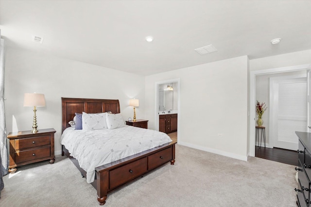 2834 Ketchum Ct, Yorkville, IL 60560 - bedroom with light colored carpet, baseboards, visible vents, and ensuite bath