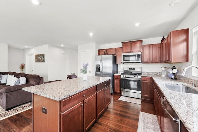 2834 Ketchum Ct, Yorkville, IL 60560 - kitchen with a sink, open floor plan, light stone counters, and stainless steel appliances