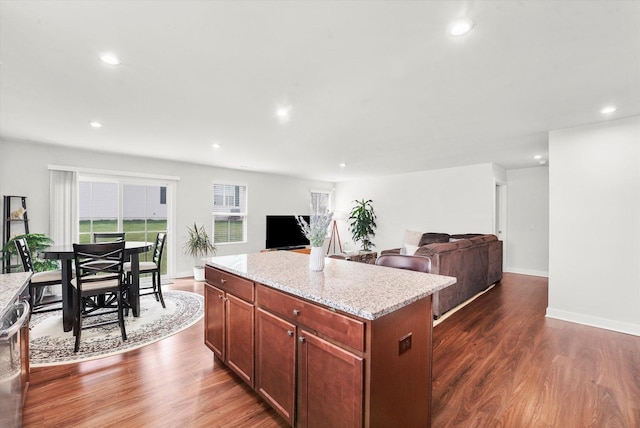 2834 Ketchum Ct, Yorkville, IL 60560 - kitchen with light stone countertops, recessed lighting, a center island, dark wood-style flooring, and dishwasher