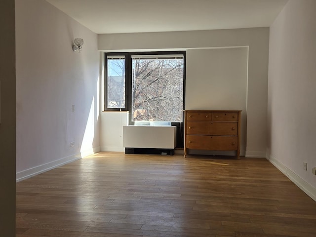 1115 S Plymouth Ct Unit 303, Chicago, IL 60605 - unfurnished room featuring baseboards and hardwood / wood-style floors