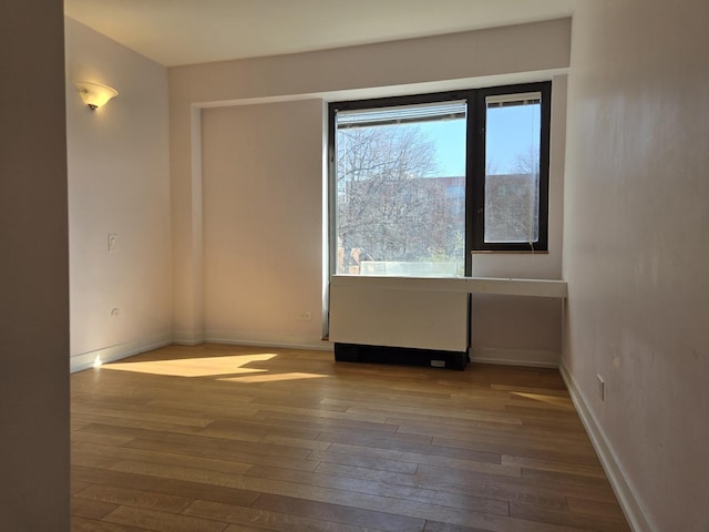 1115 S Plymouth Ct Unit 303, Chicago, IL 60605 - unfurnished room with wood-type flooring and baseboards