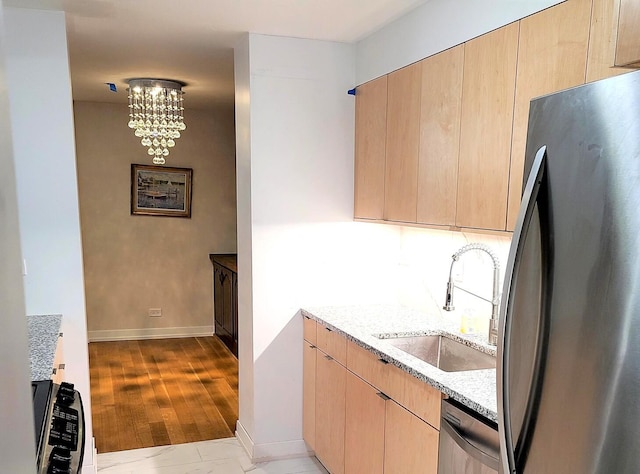 1115 S Plymouth Ct Unit 303, Chicago, IL 60605 - kitchen featuring a sink, refrigerator, light brown cabinetry, and light stone countertops