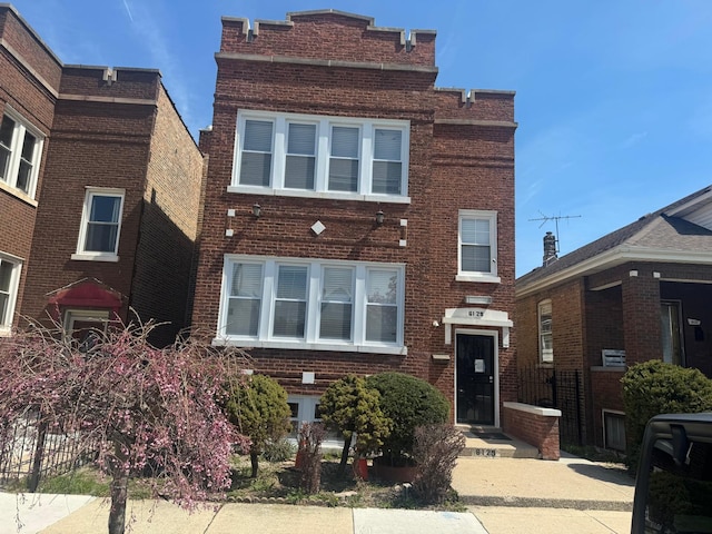 view of front of property featuring brick siding