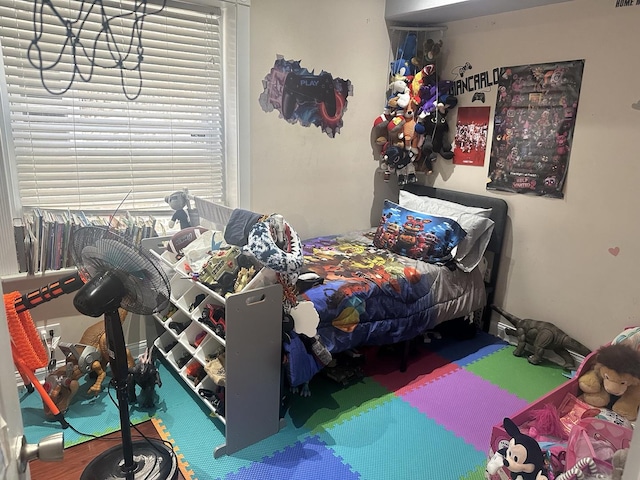 bedroom with multiple windows