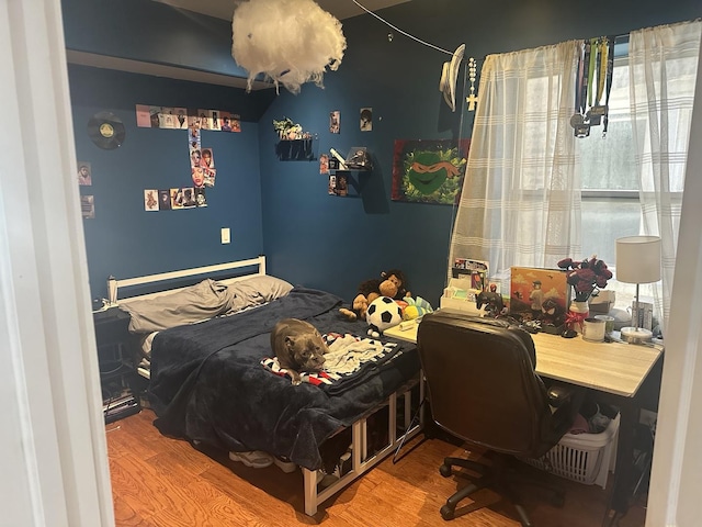 bedroom with wood finished floors