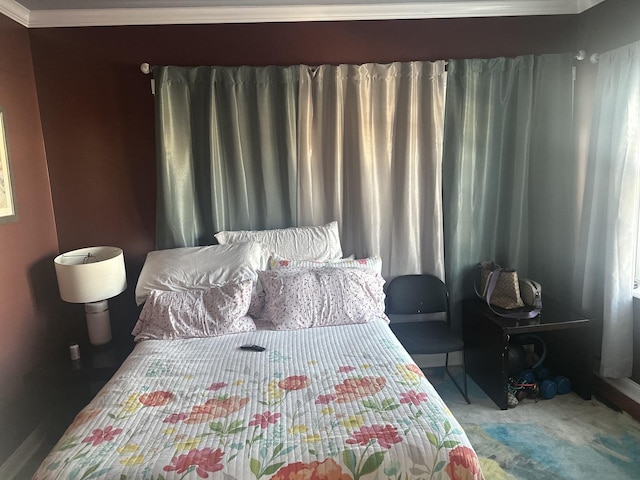carpeted bedroom featuring ornamental molding